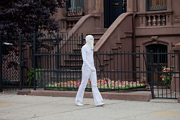 The artist walking around Harlem as Mr. Dropout. Image by Tod Seelie.