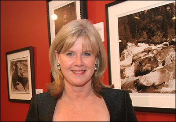 Tipper Gore and her photographs, exhibited at Mitchell Gold + Bob Williams retail furniture store in Boston. Courtesy Christina Caturano for the Boston Globe.