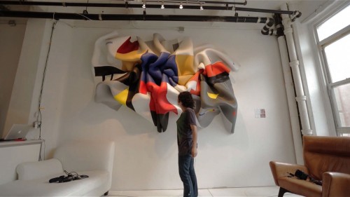 Artist Marela Zacarías installing "163–213 Manhattan" (2013) at a friend's Williamsburg apartment, 2013. Production still from the "New York Close Up" film, "Marela Zacarías's Work Finds A Good Home." © Art21, Inc. 2013.