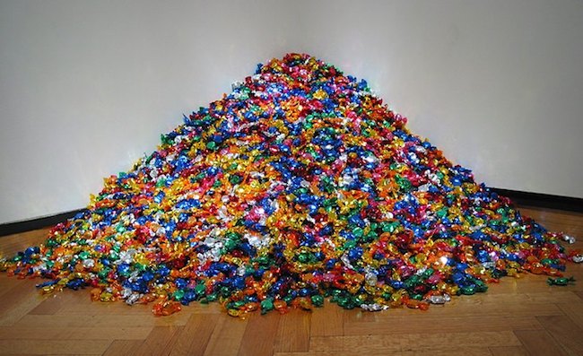 Félix González-Torres (American, 1957–1996). "Untitled" (Portrait of Ross in L.A.), 1991. Candies individually wrapped in multicolored cellophane, endless supply. Overall dimensions vary with installation, ideal weight: 175 lb. The Art Institute of Chicago; promised gift of Donna and Howard Stone. Courtesy of Andrea Rosen Gallery, New York © The Félix González-Torres Foundation