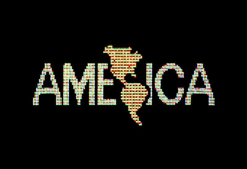 Alfredo Jaar. "A Logo for America," 1987. Digital color video, 10 min., 25 sec., edition 2/6; original animation commissioned by Public Art Fund for Spectacolor Sign, Times Square, New York, April 1987. Solomon R. Guggenheim Museum, New York, Guggenheim UBS MAP Purchase Fund. Courtesy the artist.