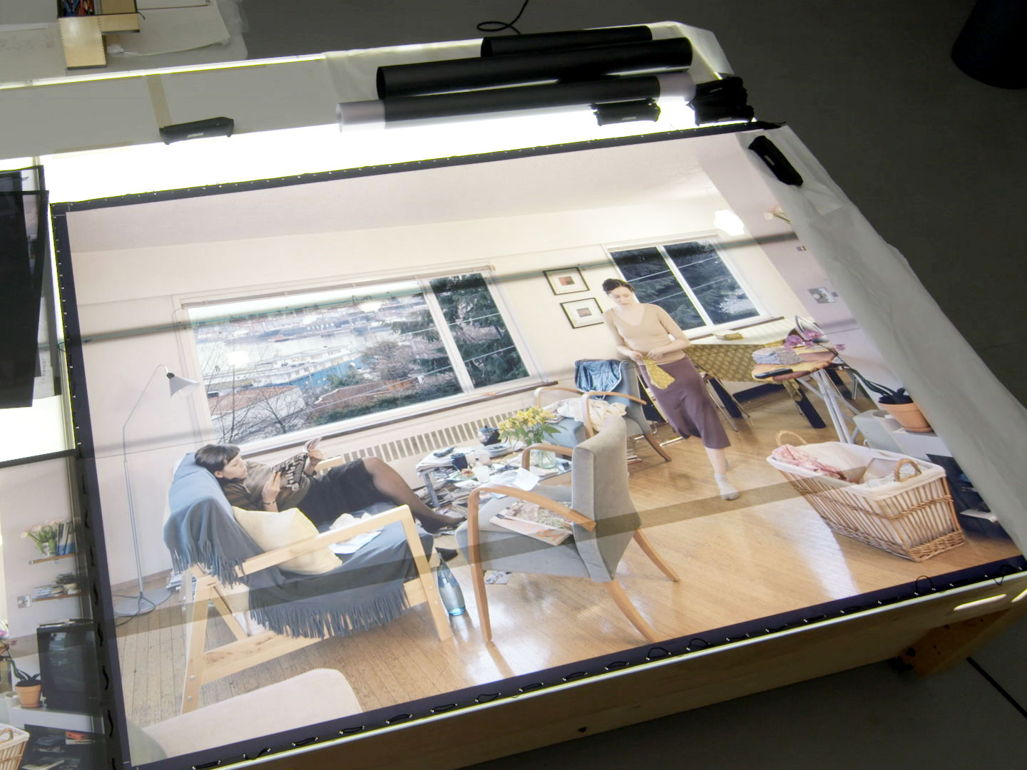 Transparencies of #JeffWall's "A view from an apartment" (2004–05) on a lightbox at the artist's Vancouver studio, as featured in a preview on art21.org from #ART21's upcoming new broadcast season. Production still from ART21’s series Art in the Twenty-First Century, Season 8, 2016. © ART21, Inc. 2016.
