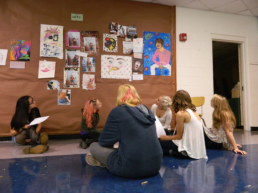 Students in Jack Watson’s advanced art class discuss works in the “Weird” section of the Bad Art exhibit. Courtesy of the author.