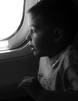 Little_boy_looking_out_window_t250