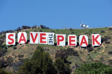 A sign reading "Save the Peak" was draped over the Hollywood Sign as part of a campaign to stop demolition planned by investors who wish to sell the land to developers.  Photo by Bauer Griffin.  Courtesy Watts Towers, built entirely from salvaged steel rods, pipes, mortar, broken ceramic tile, and found glass. Courtesty www.wattstowers.us     Watts Towers, built entirely from salvaged steel rods, pipes, mortar, broken ceramic tile, and found glass. Courtesty www.popbytes.com.