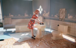 Laurie Simmons. "First Bathroom/Woman Standing" from "Interiors," 1978. Cibachrome print, 3 1/2 x 5 in. Courtesy the artist.
