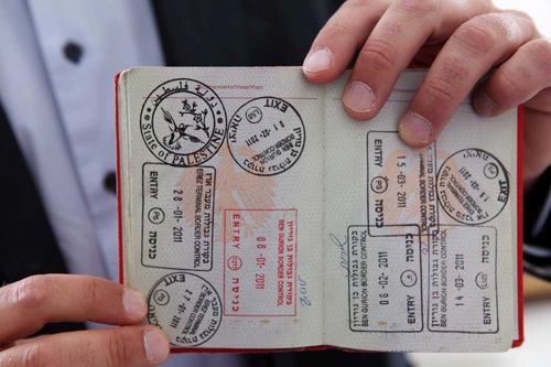 The "State of Palestine" passport stamp by West Bank artist, Khaled Jarrar. The artist stamped passports during the exhibition "MiddleEastEurope" 2011-2012. Image credit: http://electronicintifada.net