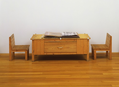 Dieter Roth, "Snow," 1964/69. Book of mixed mediums with wood table and chairs. Book (closed) 4 x 18 x 20 in. (irregular); collages, each 20 x 18 in.; commode 22 5/8 x 58 3/4 x 25 7/8 in.; chairs, each 24 1/8 x 17 3/4 x 18 1/2 in. The Museum of Modern Art, New York. Committee on Painting and Sculpture Funds.