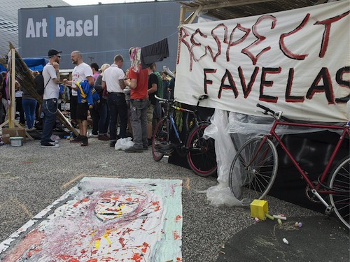 Occupation of Tadashi Kawamata’s "Favela Café" outside Art Basel, 2013.