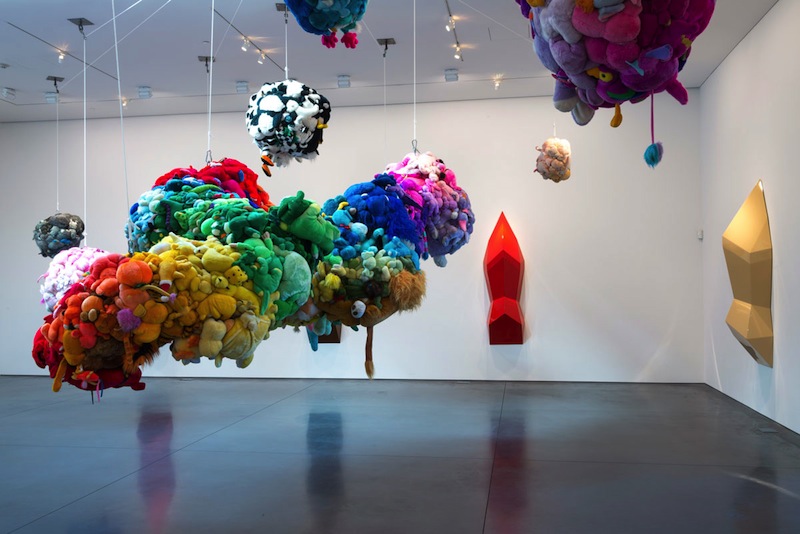 Mike Kelley, Deodorized Central Mass with Satellites, 1991/1999. Plush toys sewn over wood and wire frames with styrofoam packing material, nylon rope, pulleys, steel hardware and hanging plates, fiberglass, car paint, and disinfectant. Overall dimensions variable. (c) Estate of Mike Kelley. Courtesy Perry Rubenstein Gallery, Los Angeles. Photo: Joshua White/JWPictures.com.