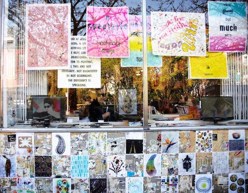 Sam Gordon in the window of Printed Matter, New York, NY. In 2013, Gordon and Eve Fowler had a two-person exhibition at Printed Matter and Feature Inc. Fowler and Gordon filled the windows with their collaboratively made posters and zines.