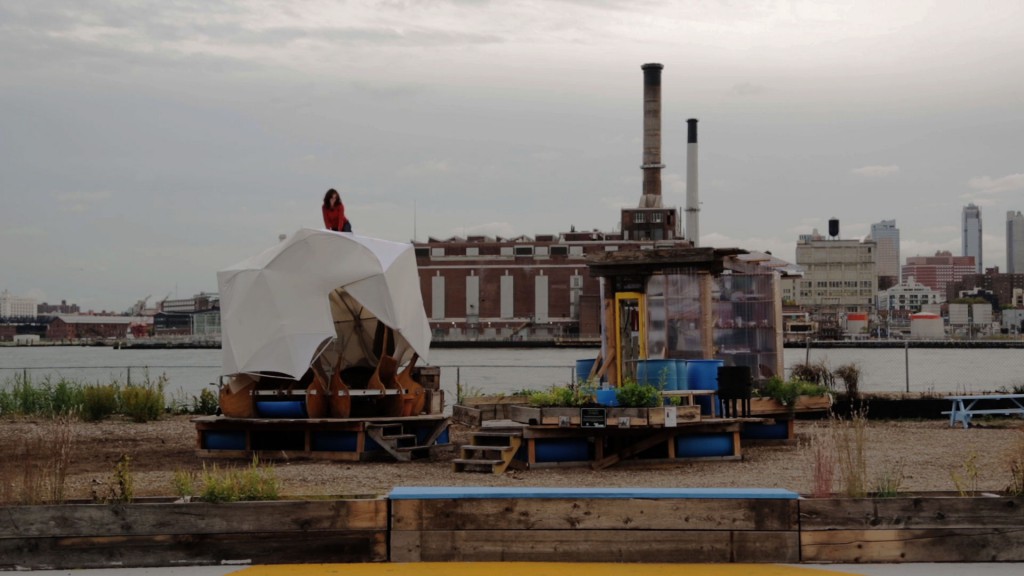 Artist Mary Mattingly constructs "Triple Island" on Pier 42, New York, 2013. Production still from the "New York Close Up" film, "Mary Mattingly's Waterfront Development". © Art21, Inc. 2014.