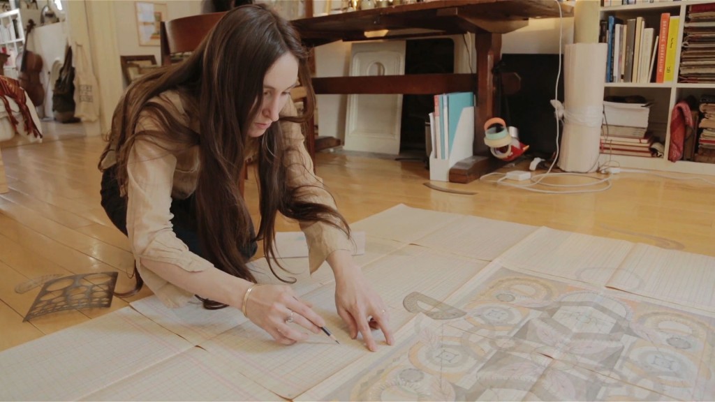 Artist Louise Despont draws with a mechanical pencil and ruler to create Mediated Polarity and the Third Property (2014) on the floor of her home and studio (Fort Greene, Brooklyn, 02.14.14). Production still from the ART21 New York Close Up film Louise Despont Draws Deep. © ART21, Inc. 2014. 