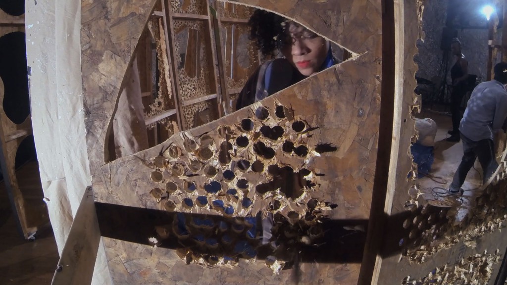 Artist Abigail DeVille in her studio residency at the Studio Museum in Harlem (Harlem, Manhattan, 04.10.14). Production still from the ART21 New York Close Up film Abigail DeVille’s Flair for the Dramatic. © ART21, Inc. 2014. Cinematography by Amitabh Joshi.