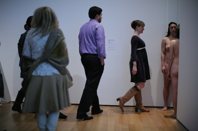 Imponderabilia; exhibition view, Marina Abramović: The Artist is Present, 2010; Museum of Modern Art, New York. Re-performed by Maria S.H.M. (left) and Abigail Levine (right); security guards not pictured. Photo: Scott Rudd.