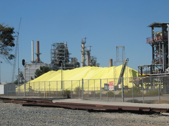 A. Laurie Palmer. Sulfur pile, BP refinery, California. Courtesy of the artist.