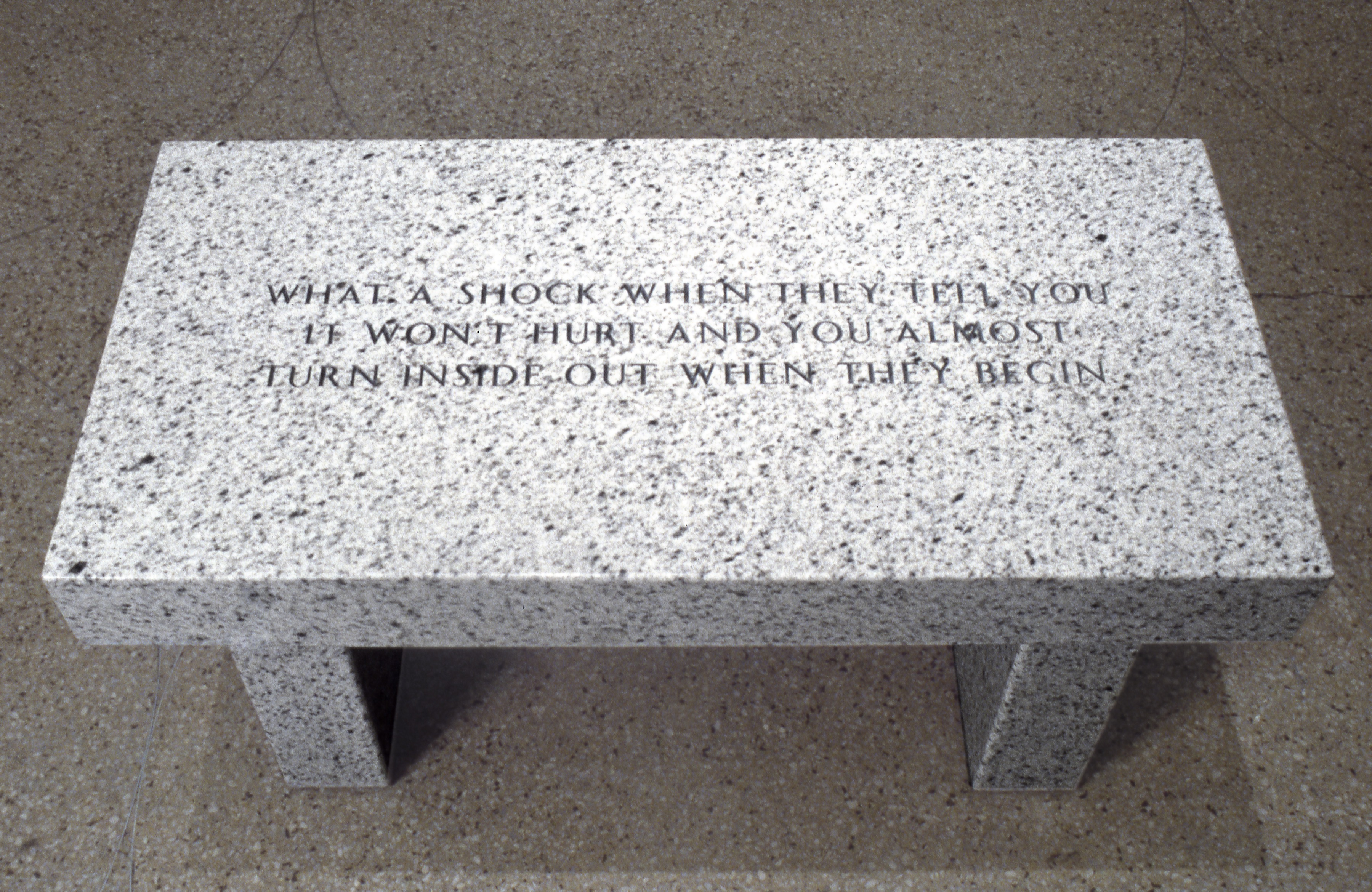 Jenny Holzer.  What a shock when they tell you it won't hurt..., 1989 . Bethel white granite bench . Text: Living (1980-82)  17 x 36 x 18 inches . Edition AP (from an edition of 3 + 1 AP). Courtesy of the artist and Sprueth Magers.