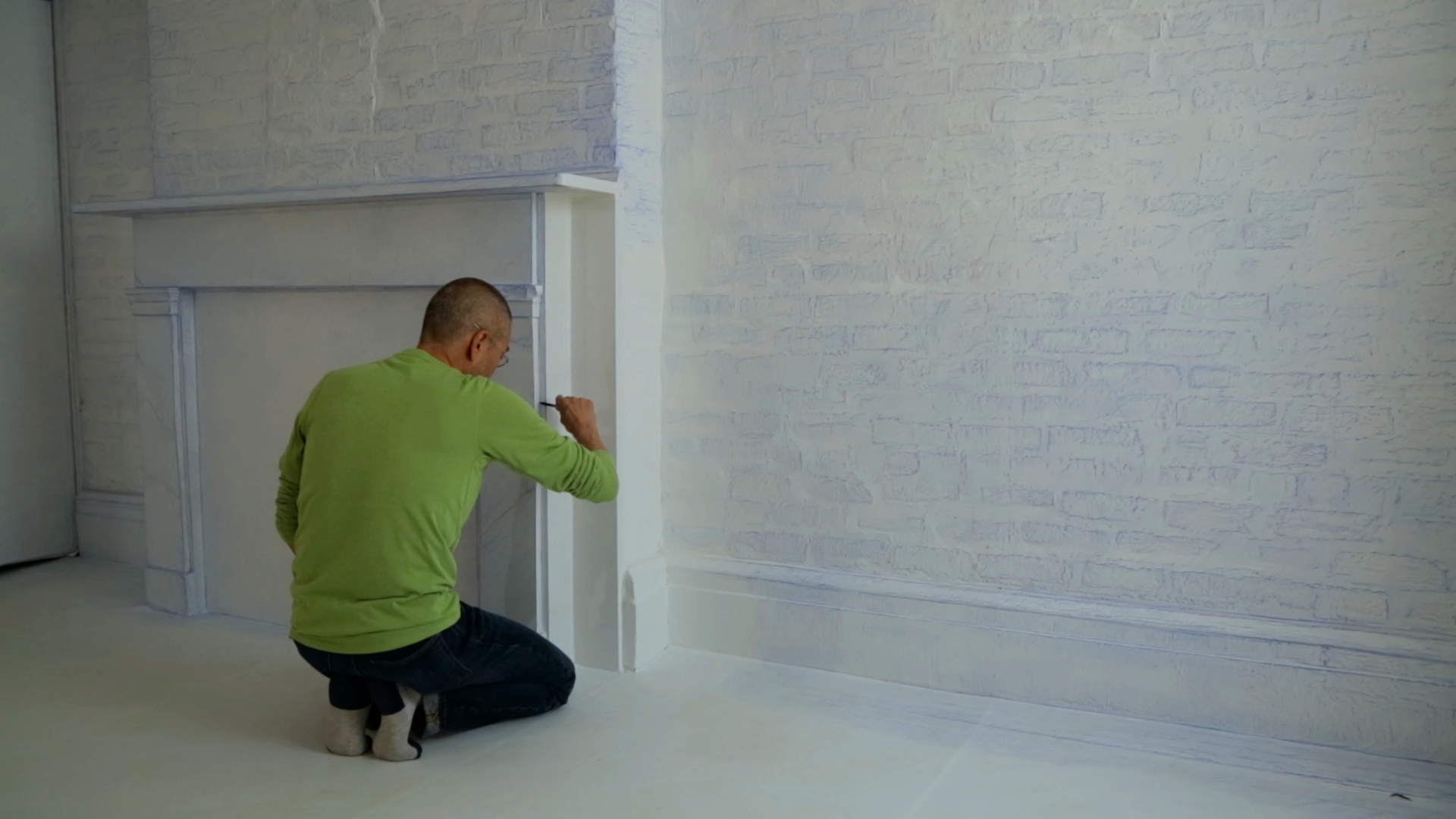 Do Ho Suh at work on Rubbing/Loving in the New York apartment where he lived and worked for eighteen years. Production still from the series Art21 Exclusive. © Art21, Inc. 2016. Cinematography: Ian Forster.